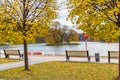 Moscow, Russia - October 16, 2019: Autumn in Tsaritsyno Park in Moscow. White wooden benches along gravel footpath on the Royalty Free Stock Photo