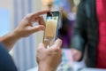 Moscow, Russia - October 04, 2019: a caucasian man`s hands hold new flagship smartphone huawei p30 pro and trst camera