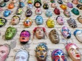 Moscow, Russia, 21 October 2019: Colorful painted ceramic faces sculpture on the bricks wall as an the object of modern