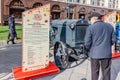 Moscow, Russia - October 08, 2019: Elderly man near restored soviet arable wheel tractor STZ on the exhibition of agricultural