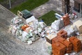 Moscow, Russia, October 20, 2019: Empty building materials packaging and construction debris are piled on street in front of new