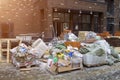 Moscow, Russia, October 20, 2019: Empty building materials packaging and construction debris are piled on street in front of new