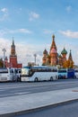 Moscow, Russia - October 08, 2019: Excursion buses on Red square against Spasskaya tower of Moscow Kremlin and Saint Basil Royalty Free Stock Photo