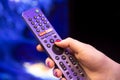 Moscow, Russia - October 04, 2019: female hand holds a smart TV remote with an android button with microphone and voice