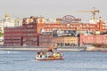 Moscow, Russia - October 03, 2019: Floating tourist ship on Moskva River against building of Moscow confectionery factory Red Royalty Free Stock Photo