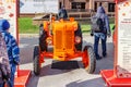 Moscow, Russia - October 08, 2019: Front view of the restored vintage orange italian wheel tractor FIAT 25. Traditional festival