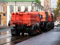 Moscow, Russia - October 19, 2019: Irrigation sweepers trucks stand on the tram tracks in front of the intersection in