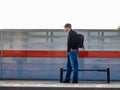 Moscow. Russia. October 4, 2020. A lone man in a protective medical mask stands on the platform of the railway