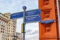 Moscow, Russia - October 08, 2019: Metal pole with tourist direction signs close-up on Manezhnaya square in Moscow against blue