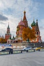 Moscow, Russia - October 08, 2019: Moving cars on the road near Saint Basil Cathedral on Red square in sunny autumn evening. Royalty Free Stock Photo