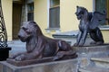 Statues of a cast-iron lion and the fairy-tale griffin