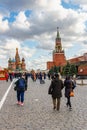 Moscow, Russia - October 08, 2019: People on Red square in sunny autumn day against Saint Basil Cathedral and Spasskaya tower of Royalty Free Stock Photo