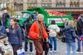 Moscow, Russia - October 05, 2019: People takes a photo against old green truck with ripe apples in the back on the traditional