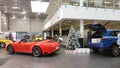 Moscow, Russia - October 05, 2019: Porsche Car Dealership. New Year decorations and preparations. Red 911 convertible stands near Royalty Free Stock Photo