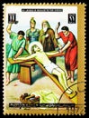 Postage stamp printed in Ajman (United Arab Emirates) shows Jesus is nailed to the cross, Easter: Stations of the Cross serie,