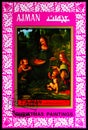 Postage stamp printed in Ajman (United Arab Emirates) shows Virgin of the Rocks; by Leonardo da Vinci, Christmas 1972 - Paintings Royalty Free Stock Photo