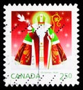 Postage stamp printed in Canada shows Saint Nicolas with dove, Christmas (2014) serie, circa 2014 Royalty Free Stock Photo
