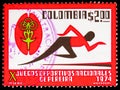 Postage stamp printed in Colombia shows Runner and Games Emblem, National Games, Pereira, 10th Ed. serie, circa 1974