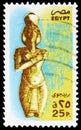 Postage stamp printed in Egypt shows Statue of Akhenaten (Amenophis IV), Theben, serie, 25 Egyptian piastre, circa 1985 Royalty Free Stock Photo