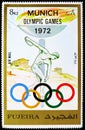 Postage stamp printed in Fujairah shows Discus thrower; Statue of Myron; Acropolis, Summer Olympics 1972, Munich serie, circa 1972 Royalty Free Stock Photo