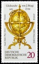 Postage stamp printed in Germany shows Globe clock, Terrestrial And Celestial Globes serie, circa 1972