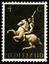 Postage stamp printed in Netherlands shows Horseman, German symbols serie, circa 1943