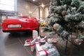 Moscow, Russia - October 05, 2019: The premium car dealership is getting ready for the New Year celebration. Red Porsche 911