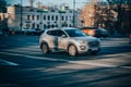 SUV car in motion. Gray Hyundai Tucson 2019 model is driving on city highway, front side view