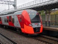 Moscow, Russia - October 5, 2021: View of the bright red train Swallow arriving at the station of the Moscow central ring