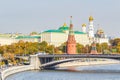 Moscow, Russia - October 03, 2019: View of Moscow Kremlin against Bolshoy Kamenny Bridge above Moskva River in sunny autumn day. Royalty Free Stock Photo