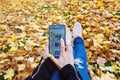 MOSCOW-RUSSIA-OCTOBER-4-2019:Woman hand using Smartphone for Facebook social media app logo install application,menu on smartphone Royalty Free Stock Photo