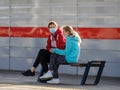 Moscow. Russia. October 4, 2020. A woman and a teenager girl in medical masks sit on a bench on the platform of a subway