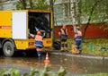 Workers conduct water pipe repair work in the street