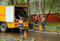 Workers conduct water pipe repair work in the street