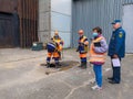 Moscow. Russia. October 7, 2020. Workers of Mosvodokanal in orange uniforms and protective helmets check the pipes