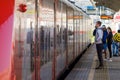 Moscow. Russia. October 4, 2020. A young man among other passengers stand on the platform of the railway station