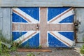 Moscow, Russia, 06/27/2020: Old wooden garage door with graffiti depicting the British flag