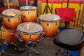 Moscow, Russia, 10 16 2017: Orange Evans Evans Drumheads Remo in the rehearsal room. Yellow and red drum in the room for musicians