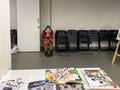 Original drawings on the table against the background of a girl sitting on a chair.