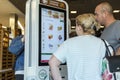 Moscow, Russia, 08/11/2019: People order food on display at McDonald`s