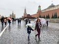 Moscow, Russia, October, 12, 2019. People walking on Red square in autumn in rainy weather