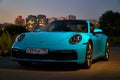 Moscow, Russia 07-02-02019 Porsche 911 Carrera 4S & x28;Miami Blue& x29; 992 Sports front car front view in the parking lot.