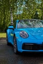 Moscow, Russia 07-02-02019 Porsche 911 Carrera 4S & x28;Miami Blue& x29; 992 Sports front of the car. Car windshield and