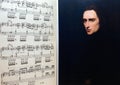 A portrait of Franz Liszt on the opened sheet music. Interior of musical room. Famous people and their works. Royalty Free Stock Photo