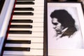 Portrait of Ludwig Beethoven next to the piano keyboard. The concept of the anniversary of the birth of the famous composer.