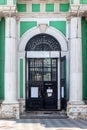 Cast-iron fence in front of the entrance to the bell tower of the Church of St. John the Baptist Royalty Free Stock Photo