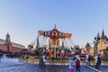 Moscow, Russia. Red Square. People ride on a merry-go-round on Christmas and New Year.