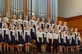 Children`s choir and soloists on stage before the start of the performance.