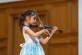 Girl violonist on the stage.