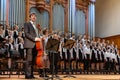 Children`s choir and soloists on stage before the start of the performance.